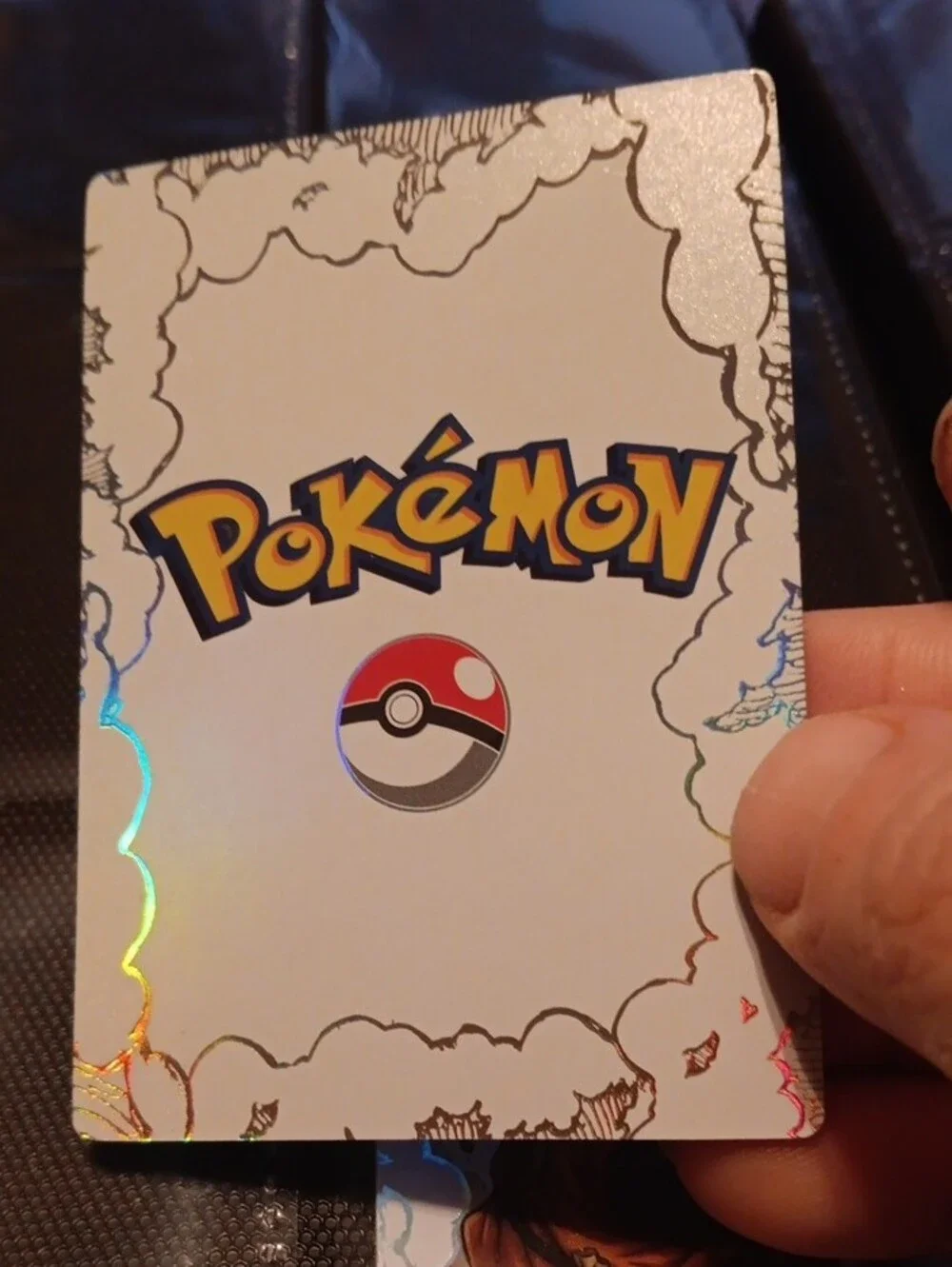 Pokemon trading card orange, gold, black, white